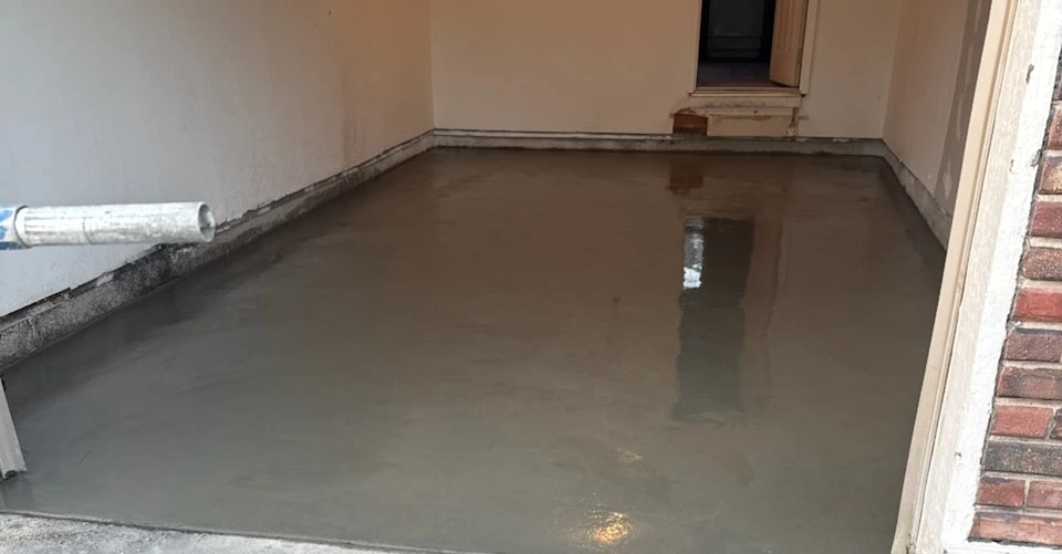 freshly poured concrete floor inside a residential garage
