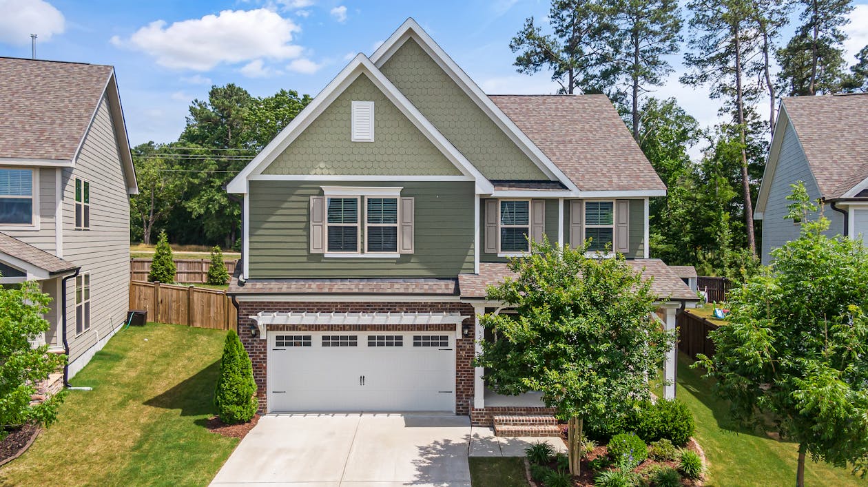 Suburban home with concrete driveway and attached garage in Kansas City Northland