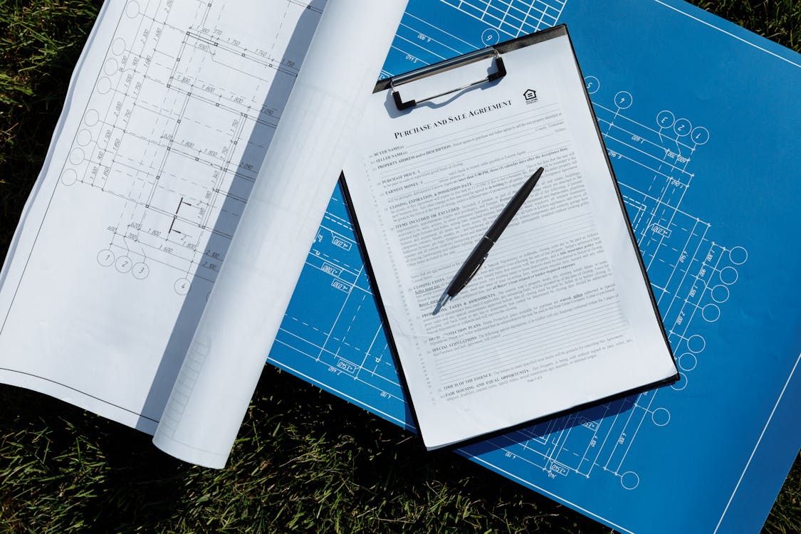 Contractor reviewing detailed project estimate on clipboard before concrete work begins