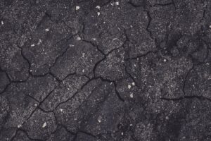 Cracked concrete driveway showing signs it needs concrete driveway replacement in Kansas City