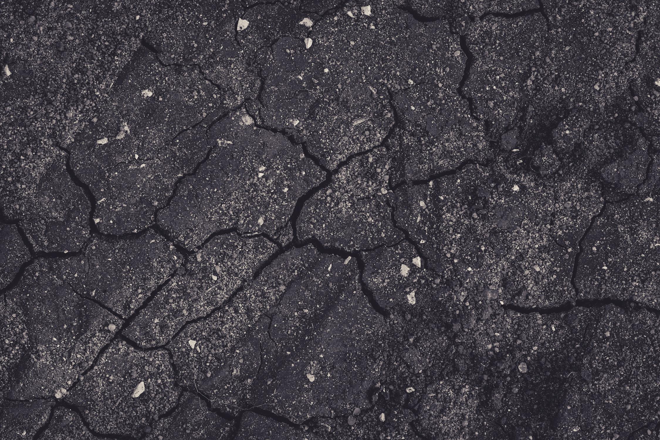 Cracked concrete driveway showing signs it needs concrete driveway replacement in Kansas City