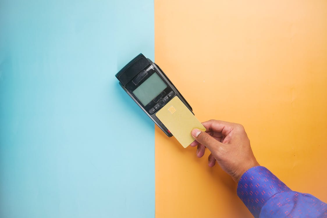 Homeowner making credit card payment for home improvement project