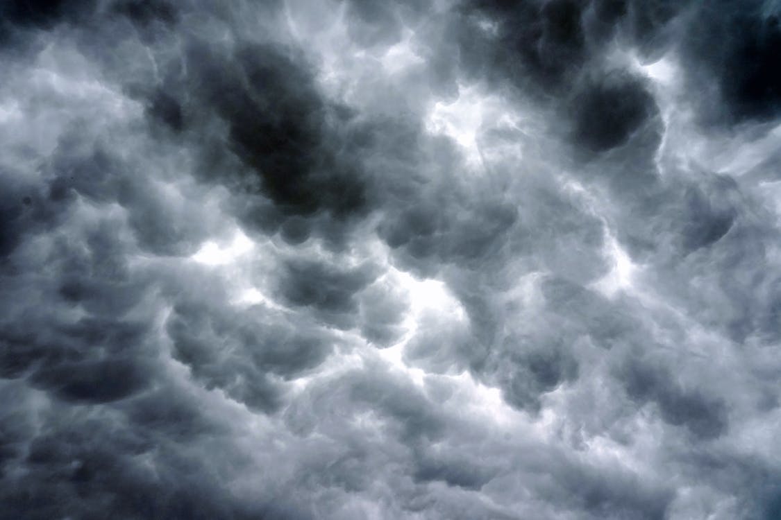 Dark storm clouds building over Kansas City threatening an outdoor concrete pour
