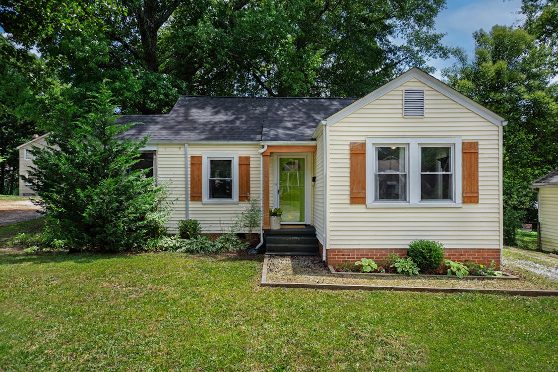 Beautiful home with finished concrete driveway boosting curb appeal and property value