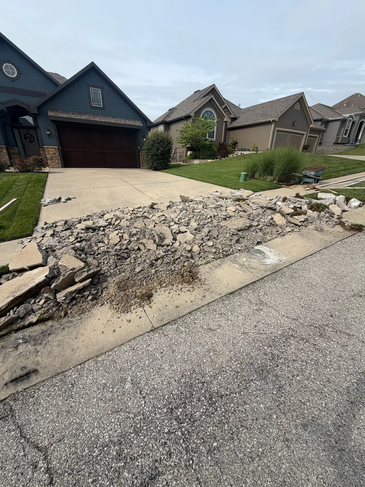 Failed D-cracking concrete driveway during full demolition by Gold’s Concrete in Kansas City